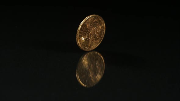 Golden coin spinning in ultra slow motion