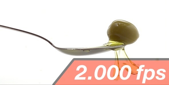 Olive Is Falling Into A Spoon With Oil 3