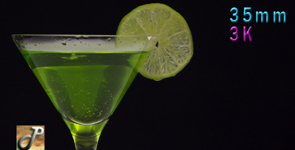 Cocktail In Martini Glass With Green Lime 