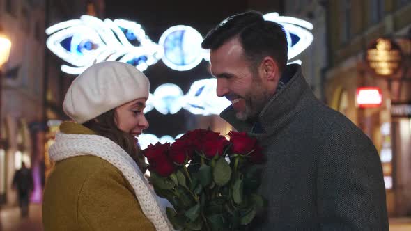 In love man giving a bunch of roses