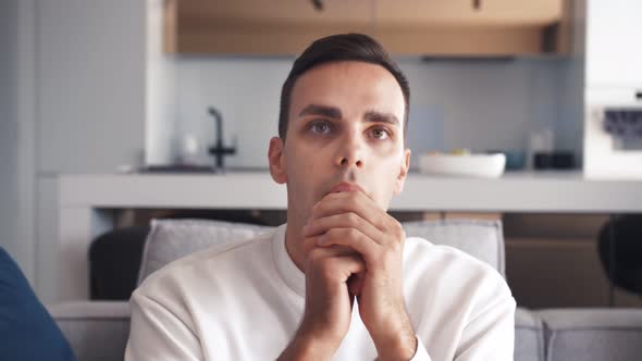 Emotional Young Caucasian Men Are Watching Tv Feel Nervous and Thrilled Concept