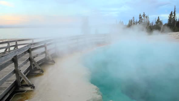 Steam And Boardwalk By A Geyser