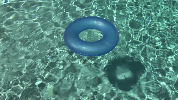 Inner Tube Floating In A Swimming Pool