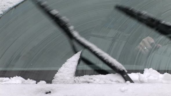 Windshield Wipers Clearing Off The Snow