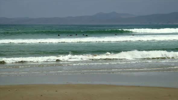 Surfers In Morrow Bay