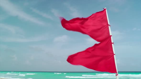 Red Flag Waving On Tropical Beach 1