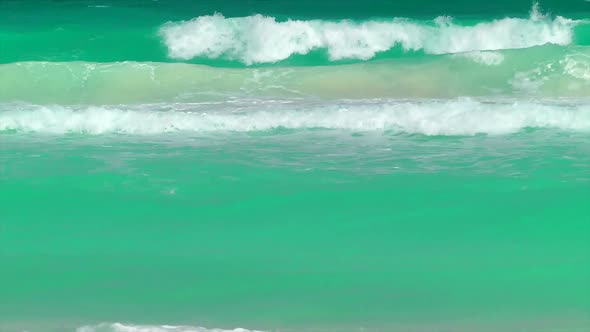 Waves Rolling In On A Tropical Beach