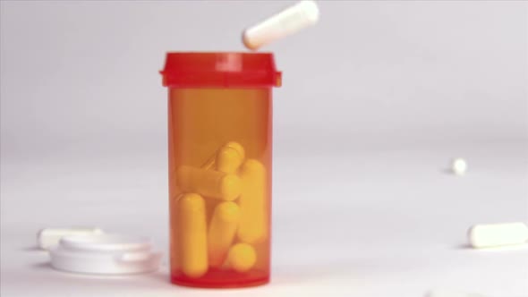 Pills Falling Into Prescription Bottle
