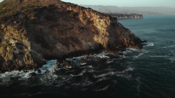 An Aerial Shot of the Point Dume Cliffs in Malibu in California as the Waves Crash Against the Rocks