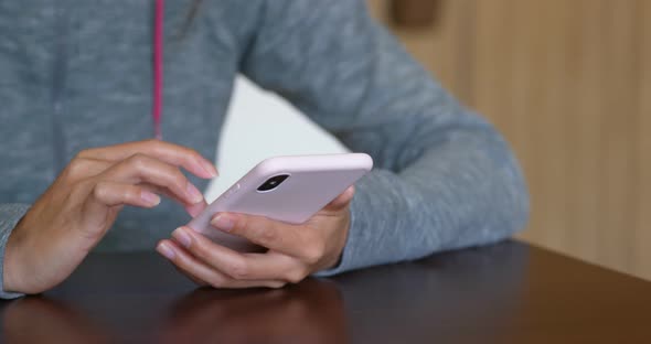 Woman touch on cellphone at home