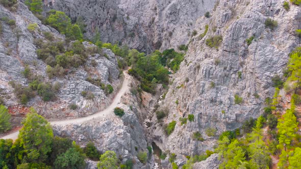 Flying Among Rocky Mountains in a Deep Prehistoric Gorge