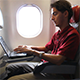 Man Working on Laptop on Airplane 1 - VideoHive Item for Sale
