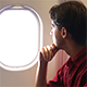 Man Looking Through the Airplane Window - VideoHive Item for Sale