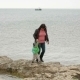 Mother And Baby Walking At The Seaside In Autumn - VideoHive Item for Sale