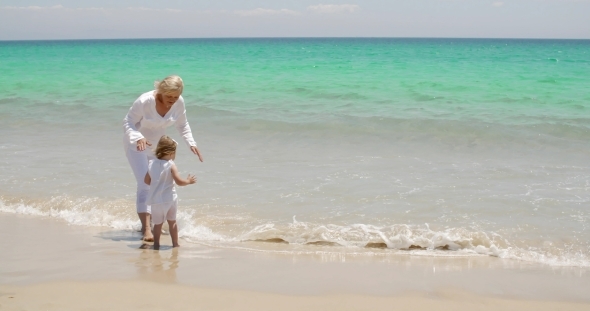 Grandmother And Granddaughter At The Seaside