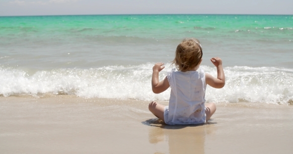Cute Little Girl Enjoying The Sea
