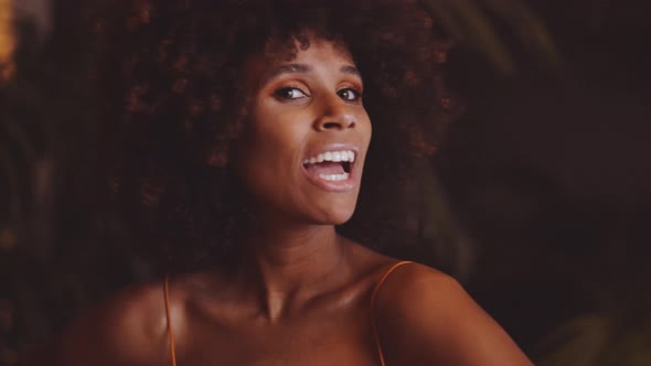 Young Beautiful Woman With Afro Posing And Laughing To Camera