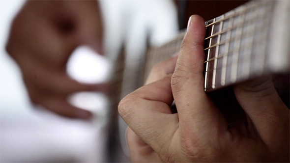 Hand Playing Guitar