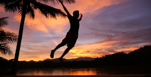 Man Running And Jumping In Sunset