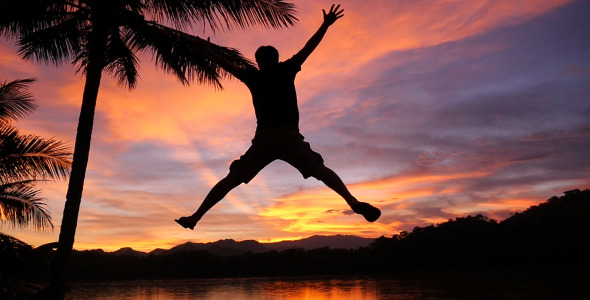 Man Jumping In Sunset