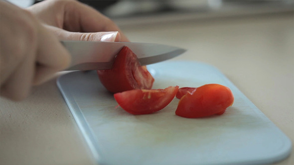 Cutting Tomatoes With A Knife