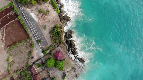 Aerial View of Sand Beach with Rocks and Green Cliff, Bali