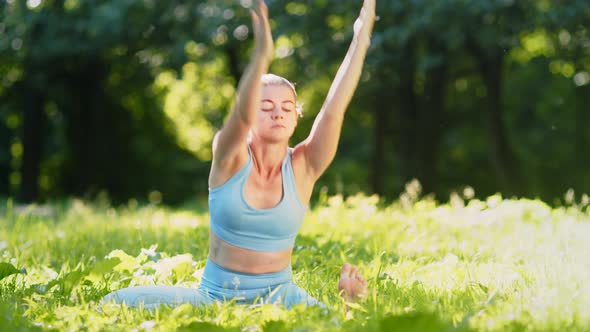 Sportive yoga practitioner in blue top