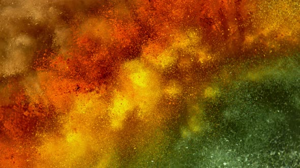 Super Slow Motion Shot of Colorful Seasoning Explosion on Black Background at 1000Fps.