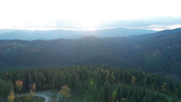 Aerial Flyover View Mountain Ski Slope in the Fall Revealing Forested Valley