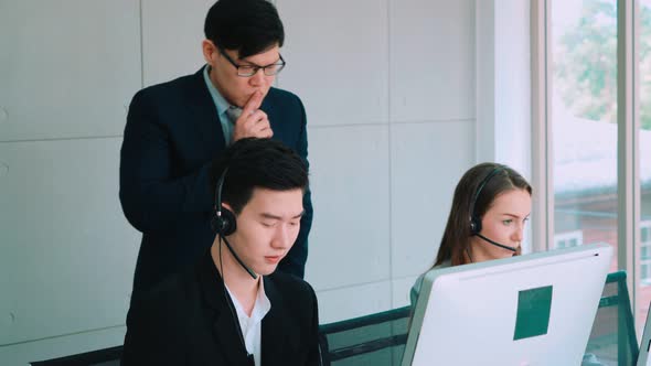 Business People Wearing Headset Working in Office