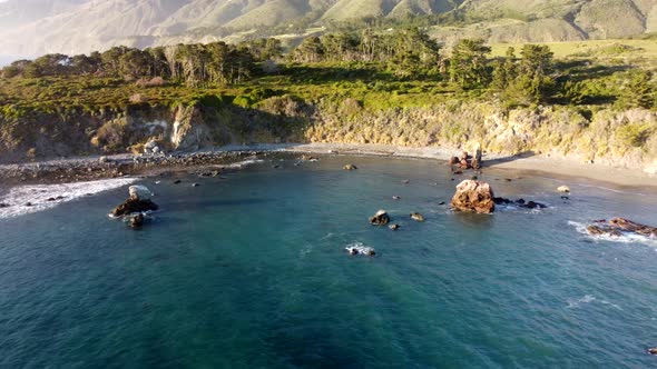 Drone shot. Pan of beach inlet at sunset. 4k 24fps.