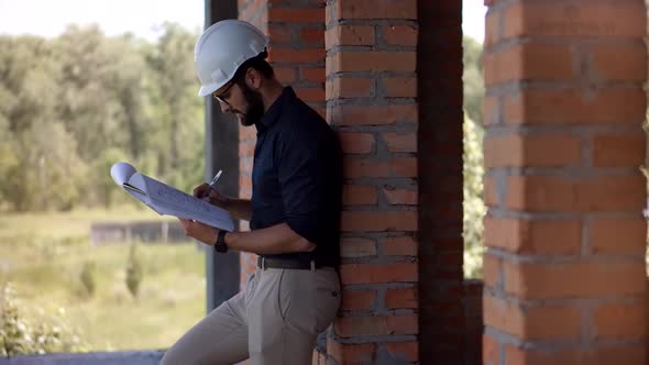 Engineer Worker.Civil Engineer Architect Construction Site.Engineer Developer In Helmet Building.