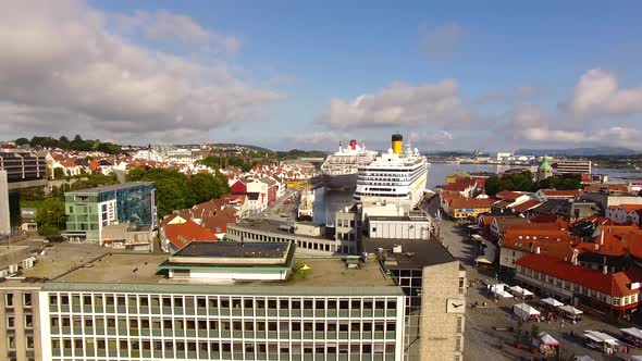 Cruise ships are moored in a harbor of Stavanger in summer, aerial view