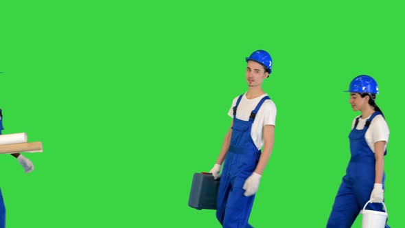 Group Of Construction Workers Meet And Smile To Camera on a Green Screen Chroma Key