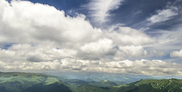 Two Fronts Of Clouds Over Mountains