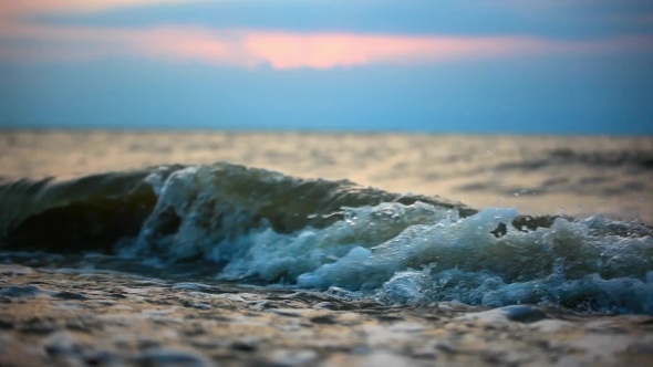 Waves Beating Against The Shore During Dramatic