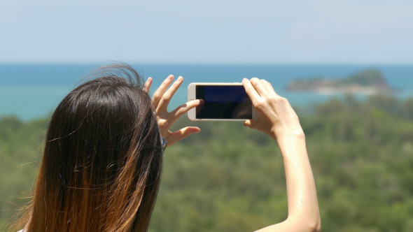 Woman Taking Picture With Smartphone