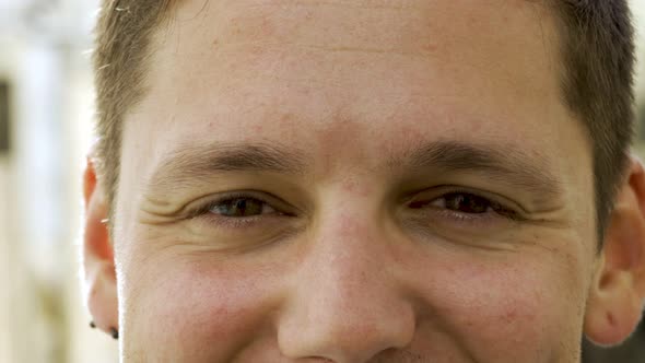 Upper Face of Young Caucasian Man Looking at Camera