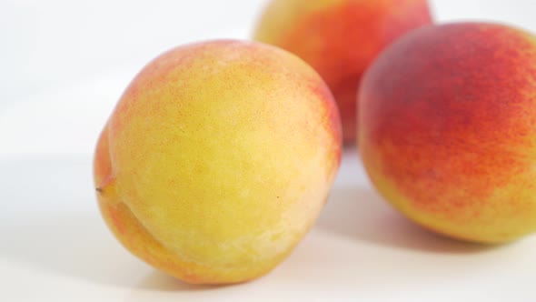 Peach juicy fruit UHD 4k 2160p footage panning  on white background - Peach on white background 3840