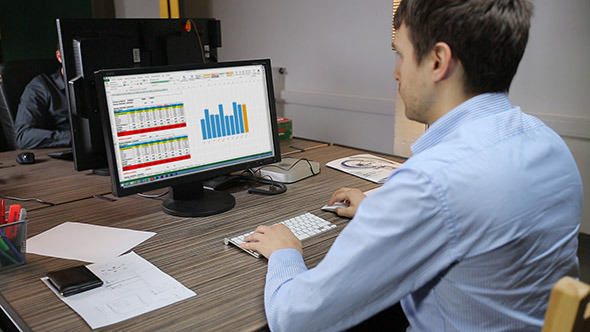 Man Looks Through Financial Statements