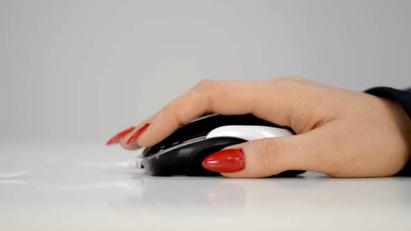 Woman Using Computer Mouse