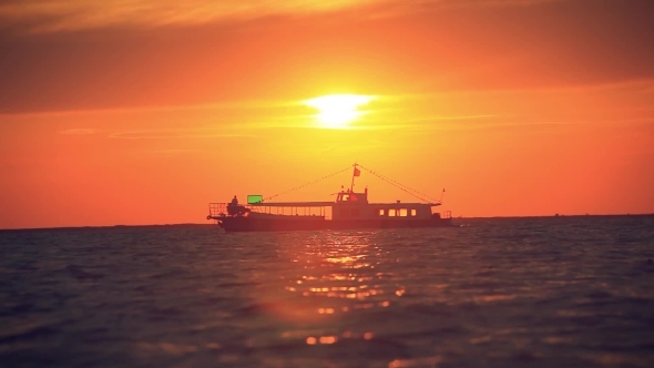 Sea Luxury Cruise Ship At Sunset And Splashes