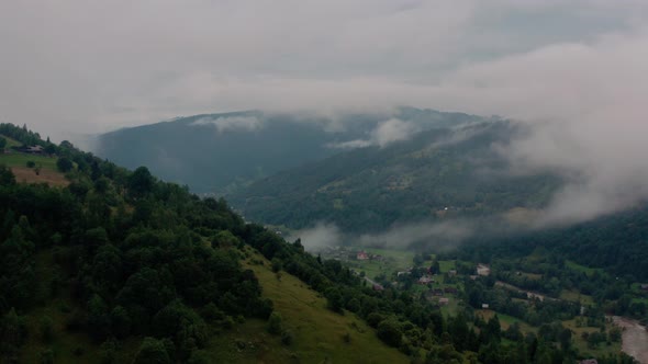 Aerial View Over Foggy Mountains After Rain