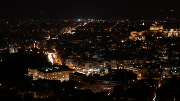 Aerial Night Timelapse of Athens downtown. Wide angle panorama with residential high-rise and small