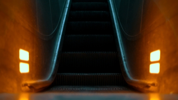 Illuminated Escalator Moving Up