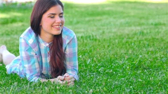 Girl Relaxing Outdoors Looking Happy And Smiling