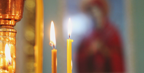 Candles on the Background of the Icon
