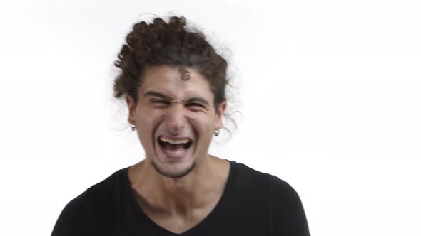 Closeup of Cheerful Latino Guy with Curly Ponytail and Beard Having Fun Laughing and Smiling Clap