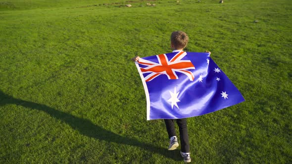 Boy waving the Australian flag.