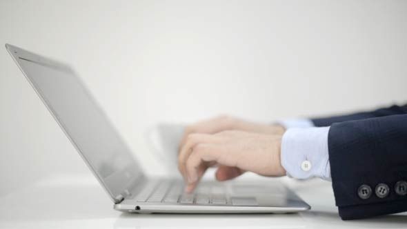 Typing on Laptop Businessman